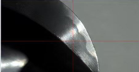 Magnified ball-nose wear on KCTP 2080 R4 8070 after 15 hours of mold finishing